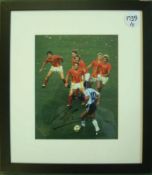 Maradona Signed Print: A colour picture depicting the subject with the ball at his feet playing