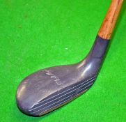 Scarce Forgan “Black Magic” mallet head putter fitted with hickory shaft and period leather grip