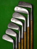 7 x Tom Stewart irons and putters ranging from a No. 2 iron, 2x mashies, jigger and 2x putting