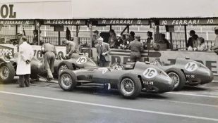 2x large Ferrari b& w motor racing photographs from 1950/60s to inc 4x Ferrari’s in the team pits