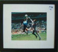 Maradona Signed Print: A colour picture depicting the famous Hand of God incident against England in