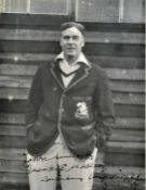 Cricket - Frank Woolley (England & Kent) – large signed photograph - of Woolley in whites and blazer