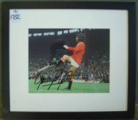 George Best Autographed Picture: A colour picture of Best in Manchester United kit signed in