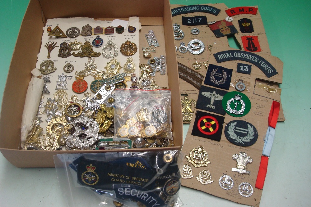 Collection of Military Badges: To include Staybrights and Brass and some Cloth covering many
