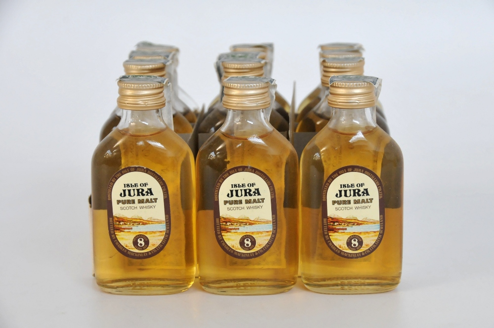 12 ISLE OF JURA MINIATURES
1 box of 12 Isle Of Jura 8yo miniatures OB circa 1980s. Levels range from