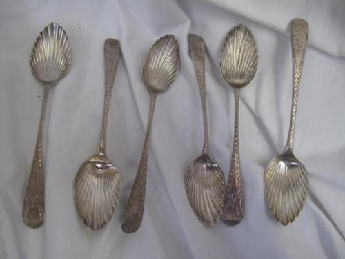 Set of six Georgian silver bright-cut teaspoons with scallop shell bowls.