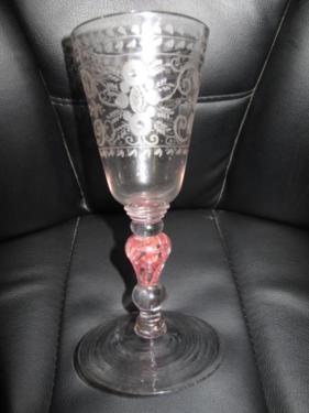 Mid 18thC goblet with a round funnelled bowl engraved with scrolling and floral decoration on a