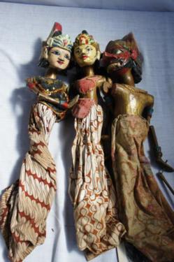 Three Balinese carved, painted figure stick puppets. Tallest: 30 ins.