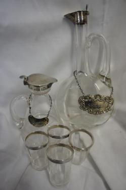 Late Victorian and Edwardian silver-topped jugs and dram glasses, together with whiskey and sherry