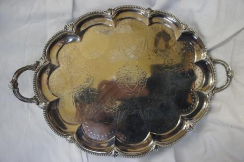 Victorian oval lobed silver two-handled tray with bead borders on quadruple scroll feet. London