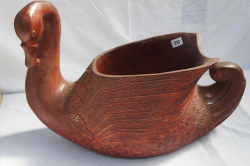 Jardiniere in the form of a carved wooden swan. Length 25 ins.