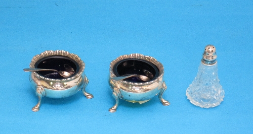 A pair of George V silver salts, cauldron form with gadrooned rim, and a silver topped glass