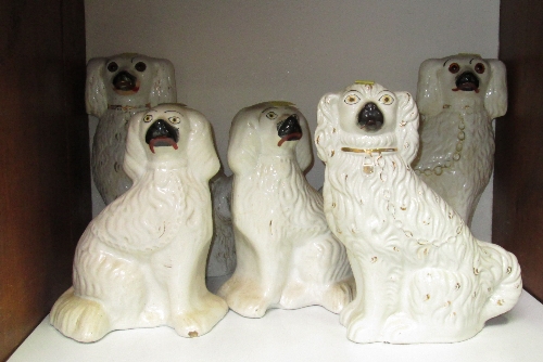 SECTION 13. Two pairs of Staffordshire china spaniels and a single spaniel.