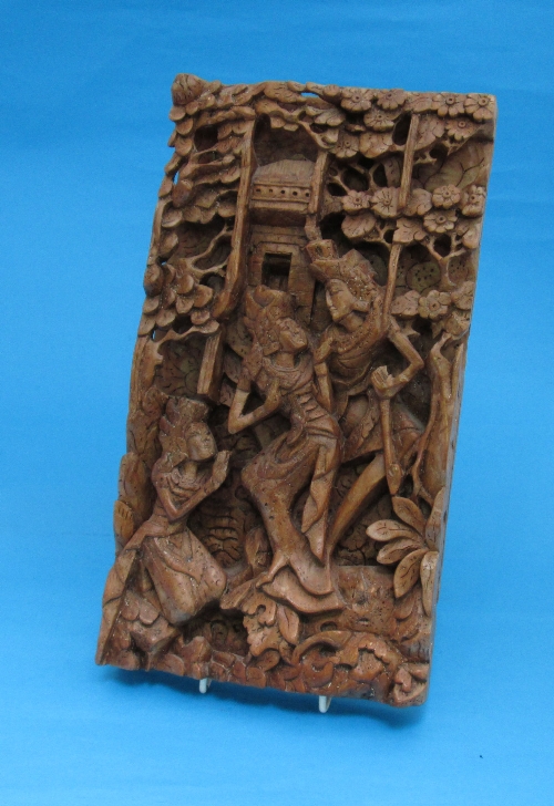 An Indian carved wood plaque, rectangular shape with allegorical figures, 36cm.