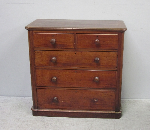 A Victorian mahogany chest, of two short over three long drawers, with knob handles, on plinth base,