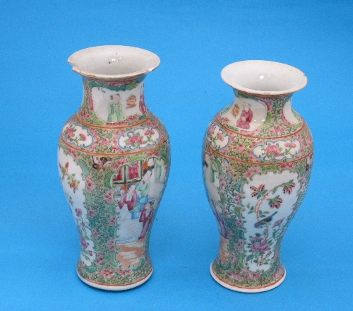 A pair of Chinese famille rose porcelain vases, with panels of figures and birds, (af), 21cm.