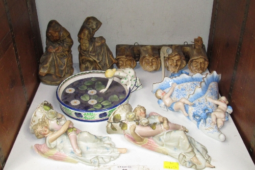 SECTION 30. A pair of porcelain figural cornucopia wall vases, in the form of angels, another with