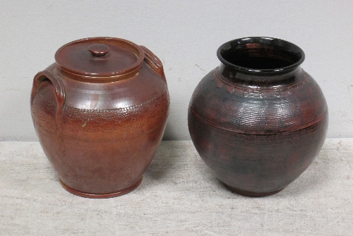 A stoneware pot, with cover, and another pot, thrown by Jennie Gilbert, 26cm.