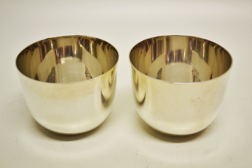 A pair of late Victorian silver tumbler cups. Makers Wakeley and Wheeler. Retailed by Rowell of