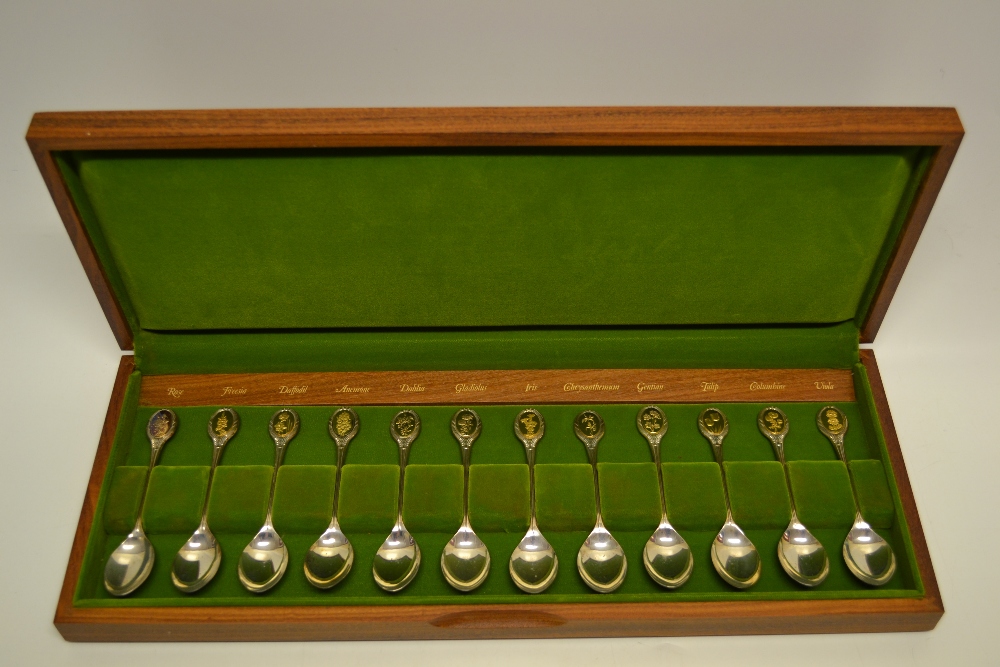 A set of twelve silver Royal Horticultural Society spoons, with gilt and medalion terminal handles