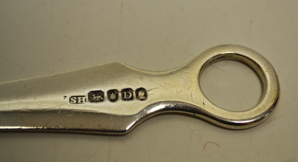 A George III silver ring top meat skewer, the chamfered shoulders with an engraved crest. Makers