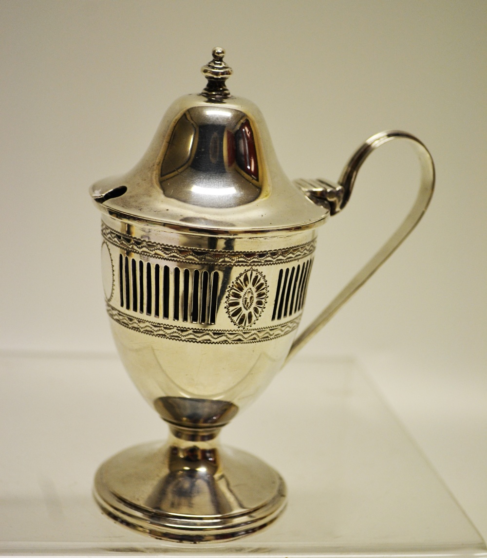 An Edwardian silver vase shape mustard pot, copying Hester Bateman the body with pierced fluted