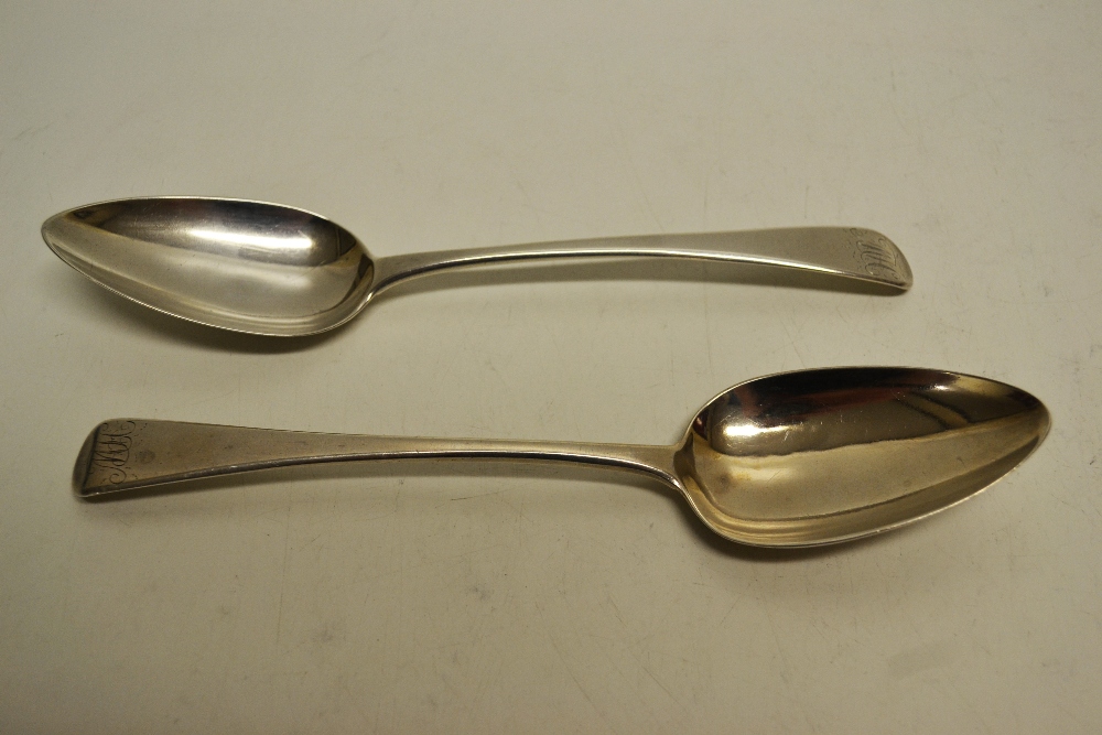 Two George III silver Old English pattern table spoons, engraved the same initial. One maker Richard