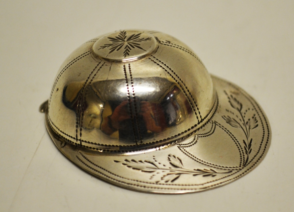 A George III silver jockey cap caddy spoon, with engraved decoration. Maker John Thornton.