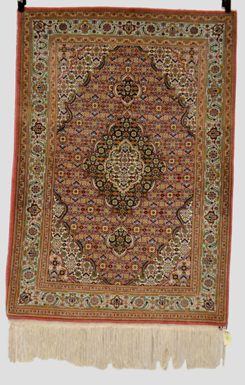 Qum rug with silk highlights, south central Persia, 20th century, 4ft. 9in. x 3ft. 4in. 1.45m. x 1.