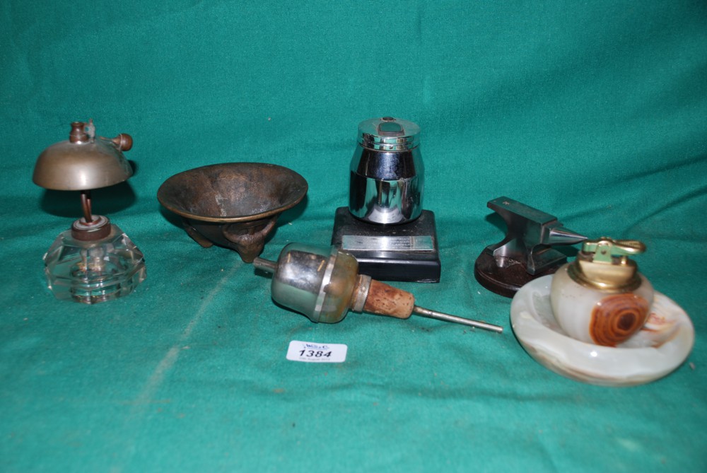 A quantity of miscellanea incl. Table Lighters, Bottle Pourer, Metal Dish standing on bull faced