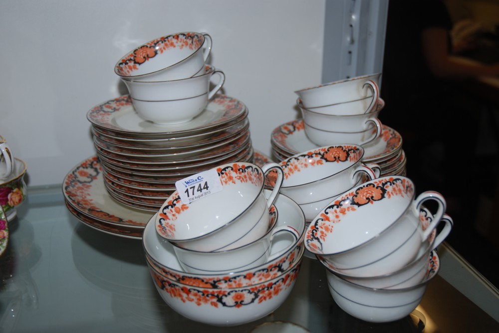 A ''Union T'' Tea set comprising twelves cups and eleven saucers, twelve Tea Plates, two Cake Plates