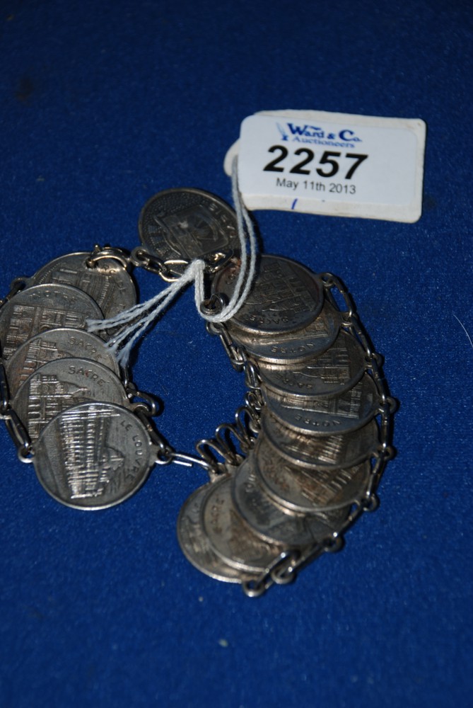 A Continental Bracelet of Fifteen Medallions Depicting Parisian Landmarks 54 Grams.