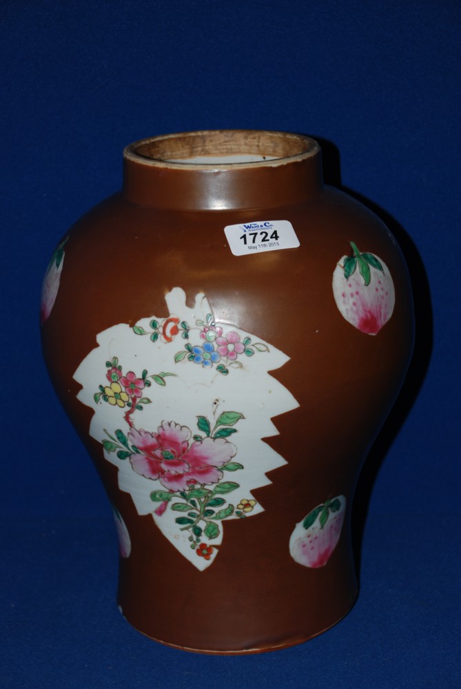 A Chinese Jar with Famille Rose decoration in panels on a brown background, 11 1/2'' tall approx.