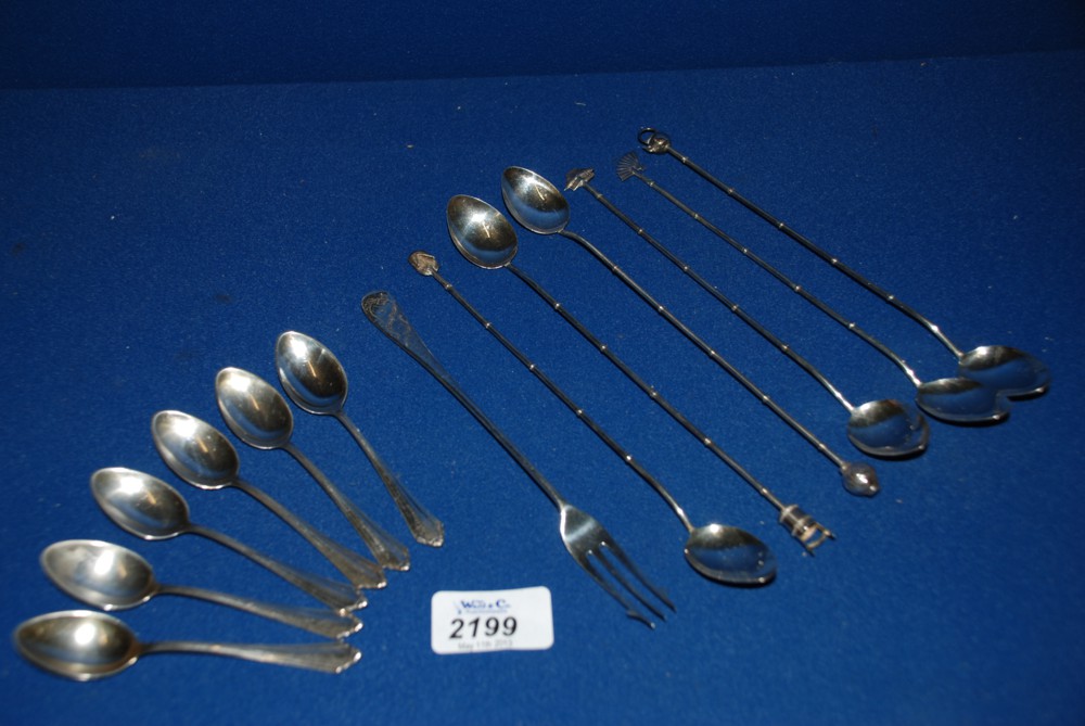 A set of six delicate Silver Spoons with long bamboo style handles and decorative ends, marked