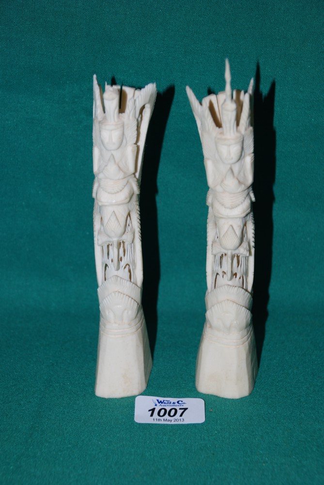 A pair of bone Carvings.