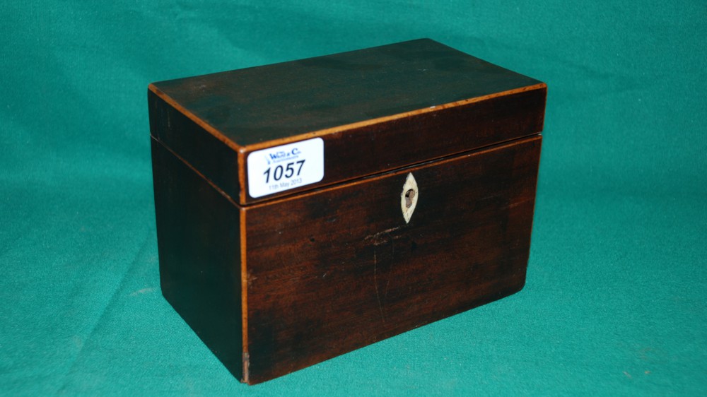 A small Mahogany Tea caddy with boxwood trimming