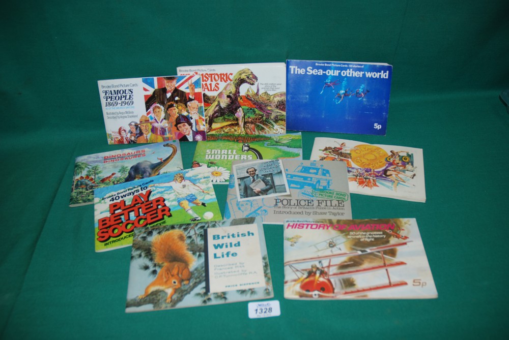 A quantity of Cigarette Card Albums including Dinosaurs, 40 ways to play soccer, Famous People,