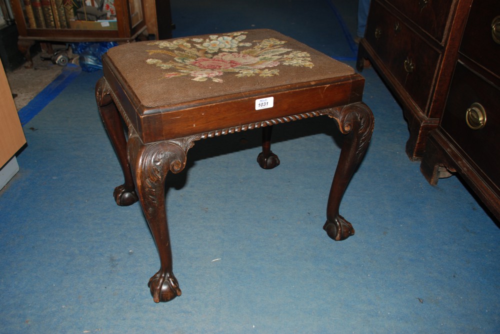 A Georgian style Stool with drop in seat and ball and claw feet.