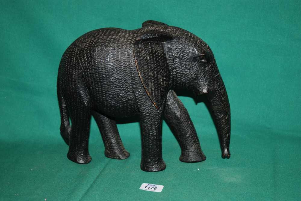 A hand carved African Elephant with textured skin effect, 10'' tall
