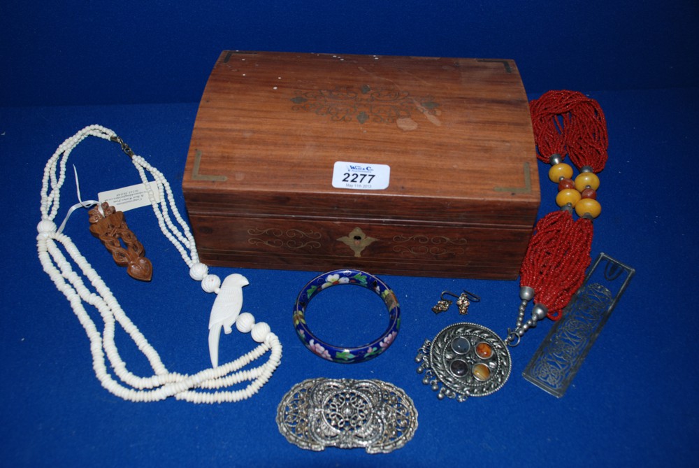 A brass inlaid Jewellery Box containing various ethnic style Beads, Necklaces and Enamel Bangle.