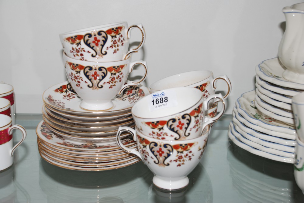 A quantity of Colclough bone china incl. six Tea cups and saucers and Plates with red, blue and gilt