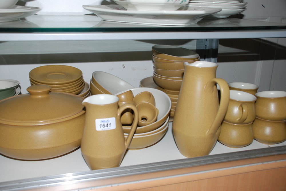 A large quantity of Denby incl. Dinner plates, cereal bowls, cups and saucers, jug, etc.