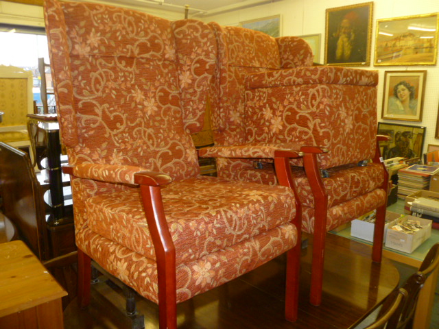 A PAIR OF UPHOLSTERED WING CHAIRS AND STOOLS