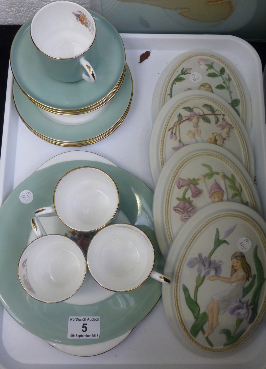 A tray of Aynsley teaware and fairy plaques