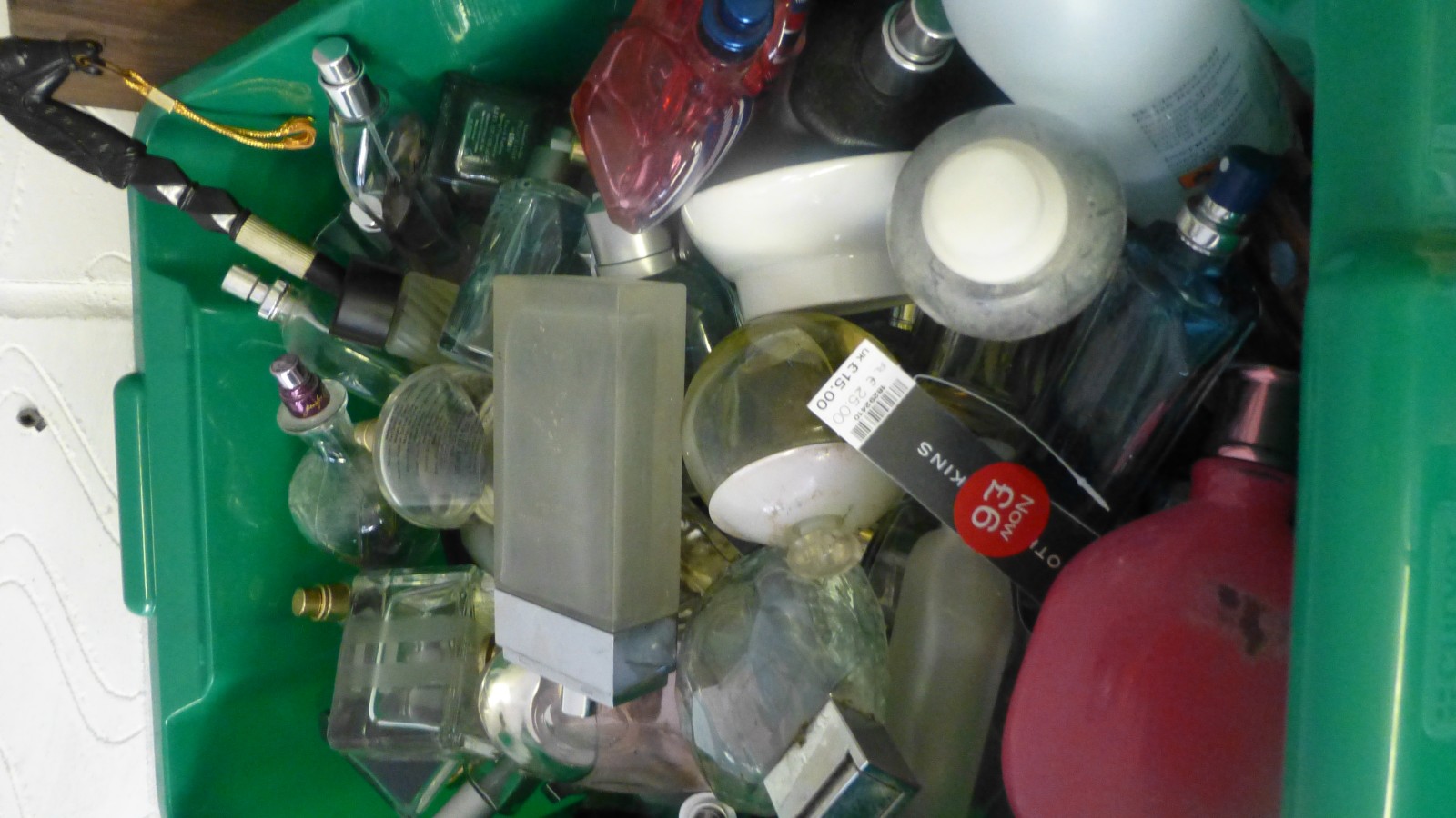 Box of part filled perfume bottles