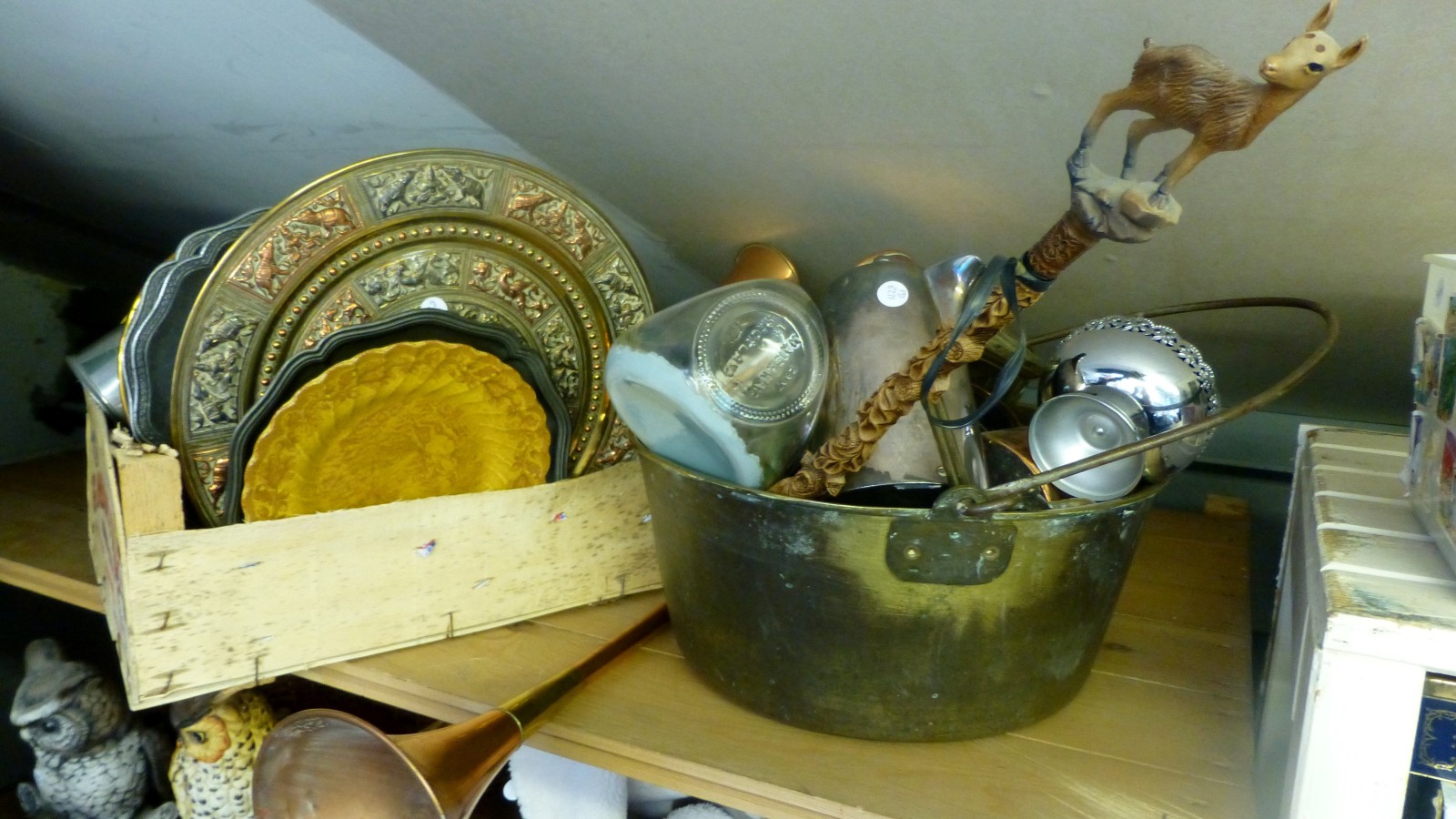 A large quantity of brass, copper and silver plated items including a jam pan