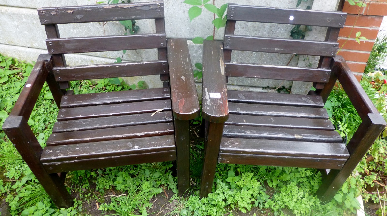 Pair of wooden garden armchairs