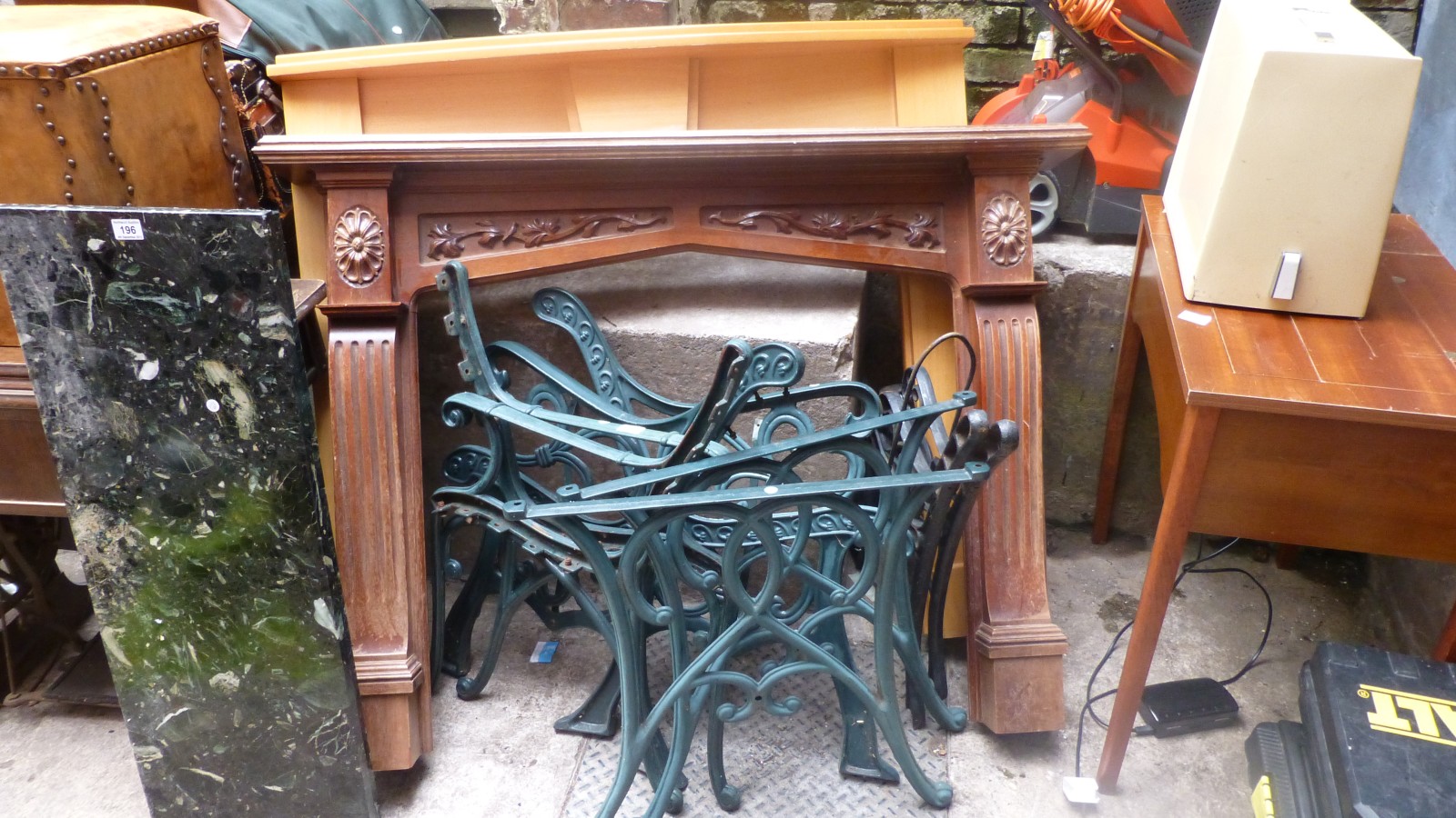 Three pairs of cast iron bench ends and a pair of cast iron table supports