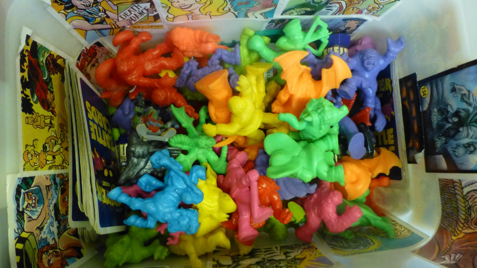 A box of collectable "Monsters in my Pocket" figures