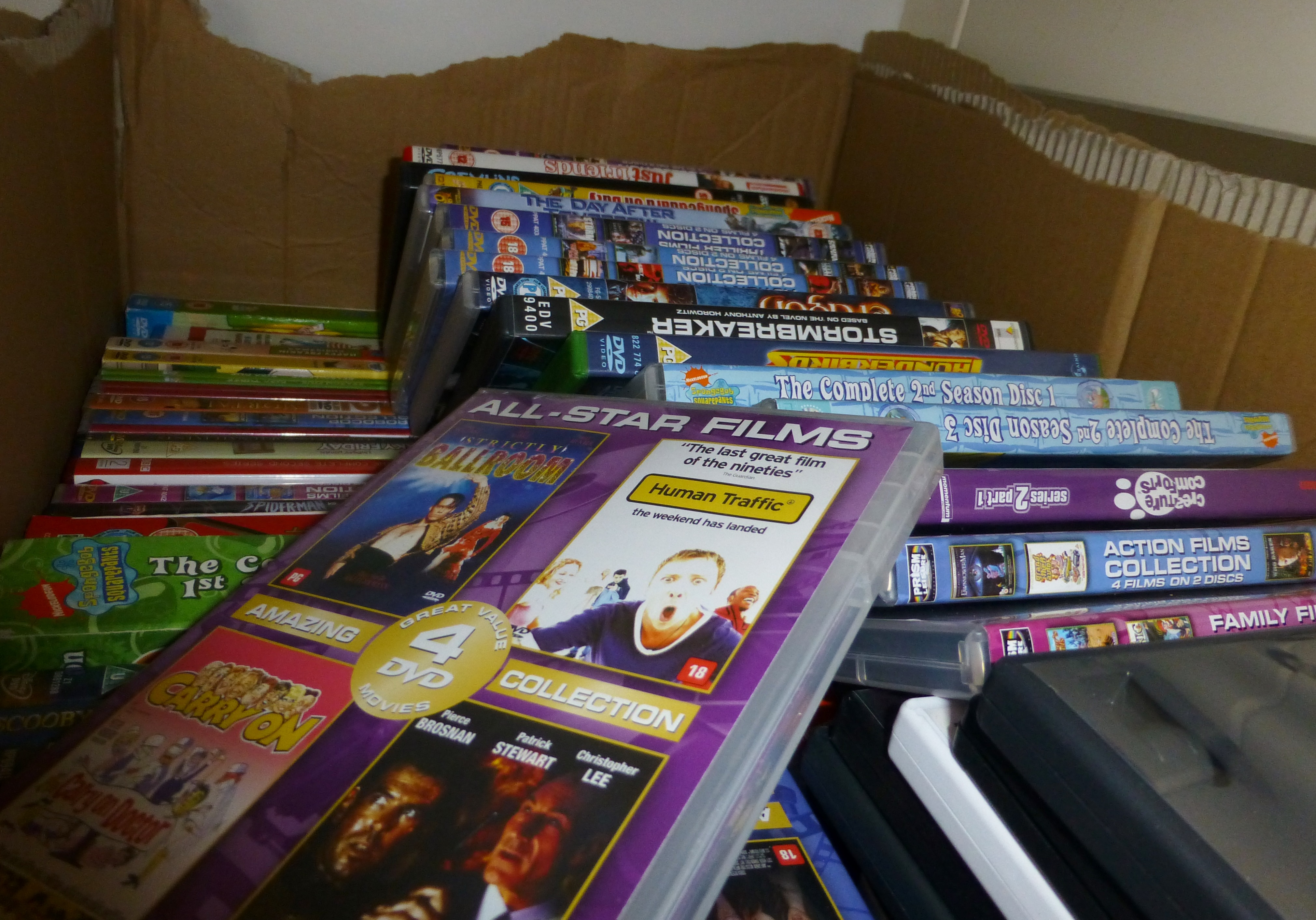 Large box of mixed DVDs